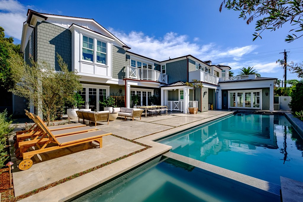 The pool is a central focus of the backyard area.